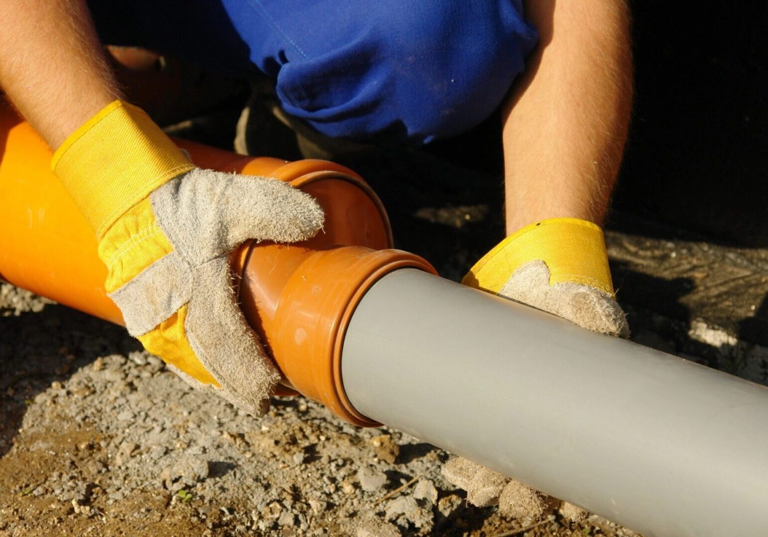 A worker working on a site on the ground